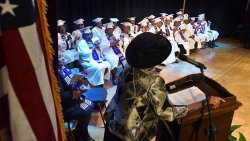 March 3, 2018 Zebulon - Graduates from the Class of 1969 applaud as their former teacher Geneva Woods (foreground) speaks during the graduation ceremony, nearly 50 years after their last days of school at Pike County Consolidated High School, at the Pike County Auditorium in Zebulon on Saturday, March 3, 2018. Forty-nine years ago, the students at Pike County Consolidated High School, an all-black institution, emptied into the street to protest the way desegregation was being handled in their community. By way of punishment, the entire Class of 1969 was barred from graduation. All seniors were refused diplomas. This Saturday, graduates from the Class of 1969 were finally honored with a graduation ceremony nearly 50 years after their last days of school at Pike County Consolidated High School in Concord. HYOSUB SHIN / HSHIN@AJC.COM