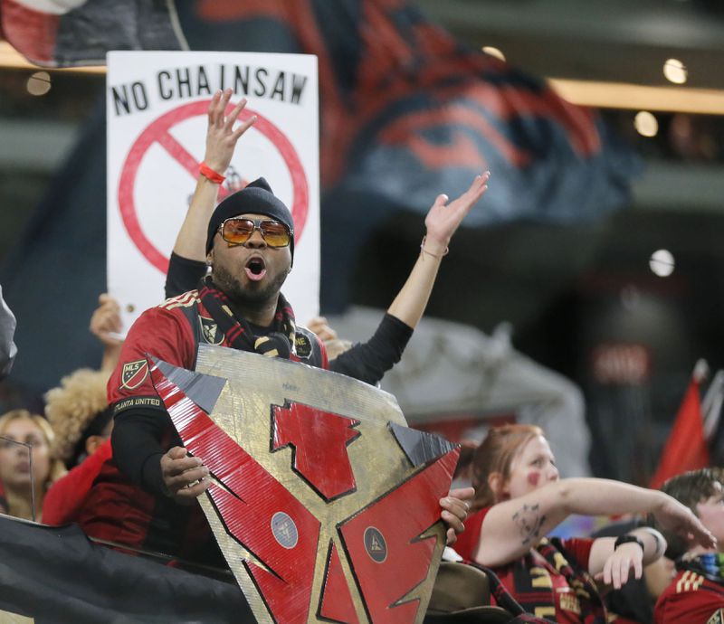 12/8/18 - Atlanta -  Fans cheer on their team during warmups.  The Atlanta United soccer team plays the Portland Timbers for the MLS Cup, the championship game of the Major League Soccer League at Mercedes-Benz Stadium in Atlanta.  BOB ANDRES / BANDRES@AJC.COM