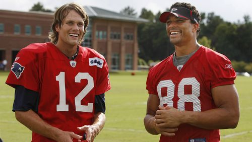 Tom Brady (12) shares a laugh with Tony Gonzalez (88) during a combined training camp practice between the New England Patriots and Atlanta Falcons Tuesday, Aug. 17, 2010, in Flowery Branch.