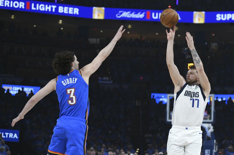 Dallas Mavericks guard Luka Doncic, right, shoots against Oklahoma City Thunder guard Josh Giddey during the first half in Game 2 of an NBA basketball second-round playoff series, Thursday May 9, 2024, in Oklahoma City. (AP Photo/Kyle Phillips)