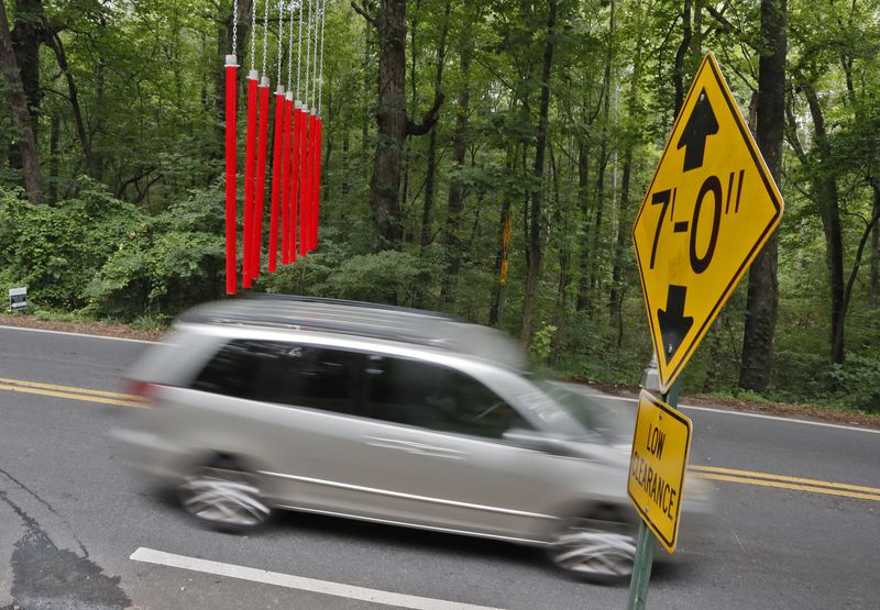 June 20, 2019 - Smyrna -  Cobb County is rolling out yet another tool designed to warn drivers of the seven-foot clearance of the Concord Road covered bridge. The county has installed mast arms along Concord Road that will have plastic-covered PVC pipes suspended at seven feet. If a too-tall vehicle hits these pipes, they should not try to pass through the covered bridge.  Bob Andres / bandres@ajc.com