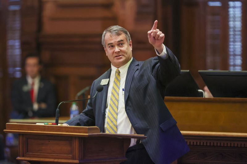 House Redistricting Chair Rob Leverett, R-Elberton, points to the voting board Friday before the chamber approved a bill redrawing its own district lines. The House backed the Republican proposal on a 101-77 vote. (Jason Getz / Jason.Getz@ajc.com)