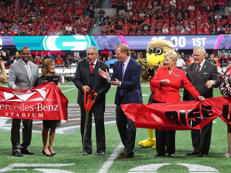  Atlanta, GA - Watched carefully by Freddie Falcon, Arthur Blank cuts the ribbon for the Falcons opener at Mercedes-Benz Stadium, with Atlanta Mayor Kasim Reed and Gov. Nathan Deal on Sept. 17.  The 50-yard line is where participants in Saturday’s 5K/Walk Like MADD event will finish. CURTIS COMPTON  / CCOMPTON@AJC.COM