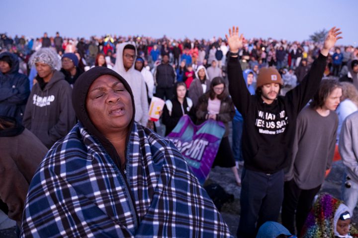 Tawanda Colquitt sings along with a song during Easter sunrise service on top of Stone Mountain on Sunday, March 31, 2024.   (Ben Gray / Ben@BenGray.com)