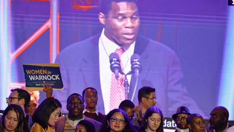 A crowd waits for Sen. Raphael Warnock to take the stage as Herschel Walker makes his concession speech during the election night watch party at Atlanta Marriott Marquis on Tuesday, December 6, 2022. (Natrice Miller/natrice.miller@ajc.com)  