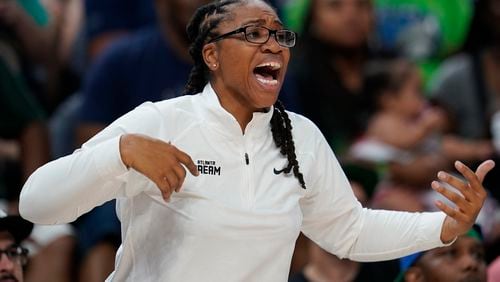 Atlanta Dream head coach Tanisha Wright reacts during the second half of a WNBA basketball game against the Minnesota Lynx, Friday, Sept. 1, 2023, in Minneapolis. The Dream lost 91-85.  (AP Photo/Abbie Parr)