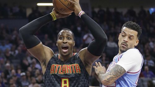 Atlanta Hawks center Dwight Howard, left, reacts after being called for a foul during the first half of the team’s NBA basketball game against the Sacramento Kings on Friday, Feb. 10, 2017, in Sacramento, Calif. (AP Photo/Rich Pedroncelli)