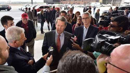 November 5, 2018 Atlanta - GOP gubernatorial candidate Brian Kemp speaks to members of the press ahead of his "Putting Georgians First" flyaround tour at Peachtree DeKalb Airport on Nov. 5, 2018. HYOSUB SHIN / HSHIN@AJC.COM