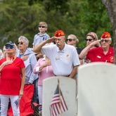 Marine veteran Doug Tasse, white shirt, second from right, salutes during the Pledge of Allegiance the 77th annual Memorial Day Observance at the Marietta National Cemetery on Monday, May 29, 2003.  (Jenni Girtman for The Atlanta Journal-Constitution)