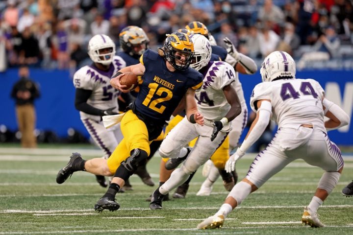 Prince Avenue Christian quarterback Brock Vandagriff (12) runs for a first down in the first half against Trinity Christian during the Class 1A Private championship at Center Parc Stadium Monday, December 28, 2020 in Atlanta, Ga.. JASON GETZ FOR THE ATLANTA JOURNAL-CONSTITUTION