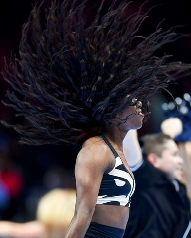 A Hawks cheerleader performs during a timeout in the first half NBA game against Indiana Pacers Tuesday, November 21, 2023 at State Farm Arena. (Daniel Varnado/For the AJC)