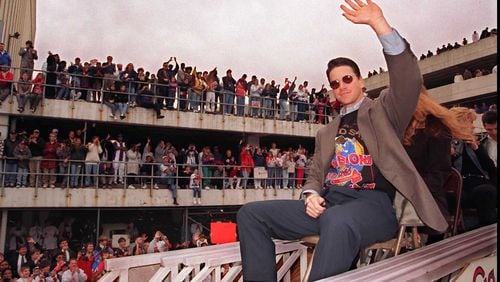 Tom Glavine, the World Series' MVP, acknowledges some of the estimated half-million fans who turned out for the Braves 1995 victory parade. (AJC file/Renee Hannans)