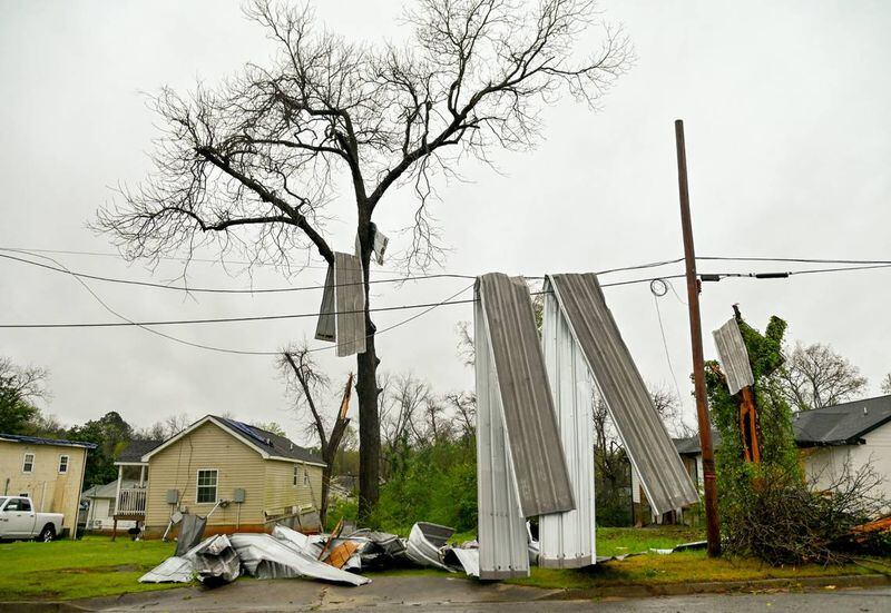 Sheet metal hangs on power lines and a tree fell on N. Wilkinson Street in Milledgeville after strong storms rolled through over the weekend. (Photo Courtesy of Jason Vorhees/The Telegraph)