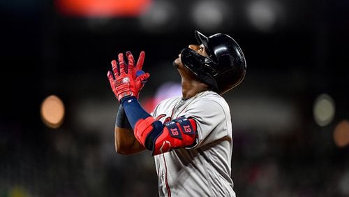 Braves left fielder Ronald Acuna celebrates after hitting a fifth inning single against the Colorado Rockies Monday, April 8, 2019, at Coors Field in Denver.