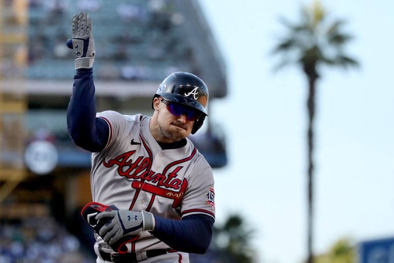 Braves center fielder Adam Duvall reacts after hitting an RBI single - scoring second baseman Ozzie Albies - to give Atlanta a 5-2 lead in the fifth inning against the Los Angeles Dodgers in Game 3 of the NLCS Tuesday, Oct. 19, 2021, at Dodger Stadium in Los Angeles. (Curtis Compton / curtis.compton@ajc.com)