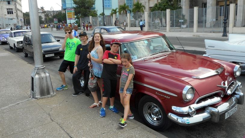 Kids from Adonia mugging for camera in front of vintage ’50s-era American car in Old Havana. (Andy Yemma)