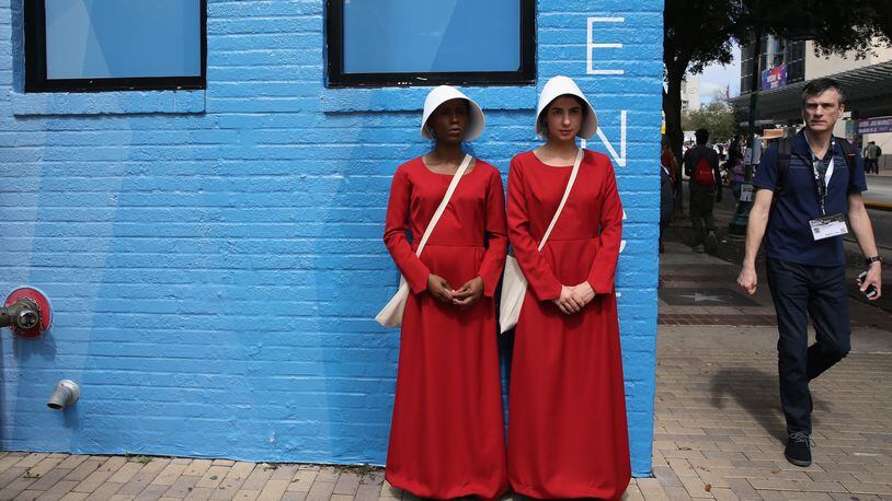 Cosplayers from the television series "The Handmaid's Tale" are seen during 2017 SXSW Conference and Festivals on March 10, 2017, in Austin, Texas.