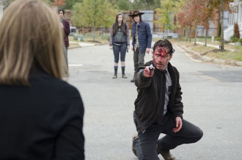 Andrew Lincoln when he was Rick Grimes on "The Walking Dead," shooting a scene in Senoia in an actual neighborhood that has been enclosed by metal fencing for eight years. AMC