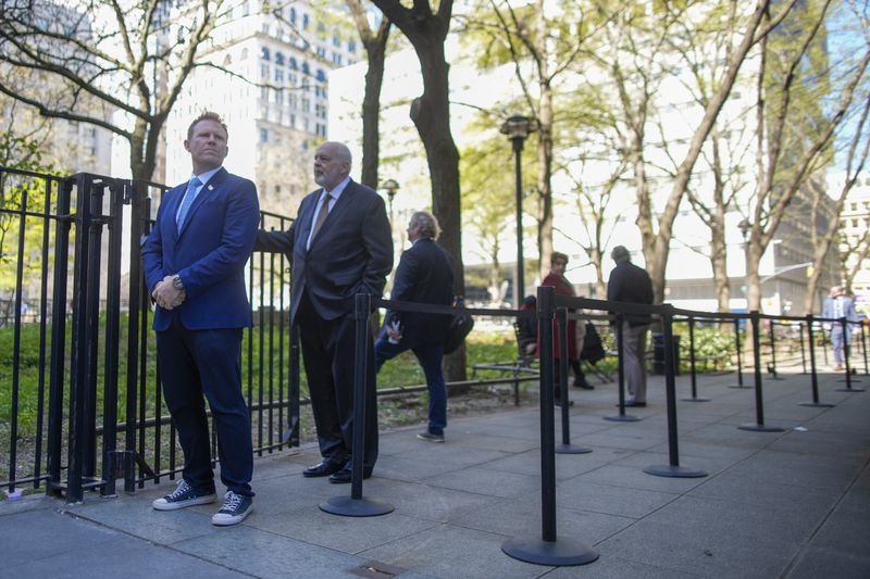 Andrew Giuliani, left, former New York City Mayor Rudy Giuliani, stands on line outside Manhattan criminal court building for a chance to get inside the courtroom to watch the proceedings in former President Donald Trump's "Hush Money" criminal trial, Monday, April 22, 2024, in New York. (AP Photo/Mary Altaffer)