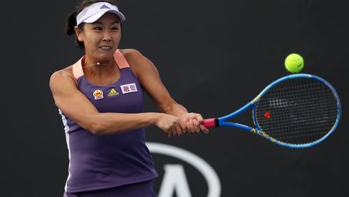 China's Shuai Peng plays a backhand during her Women's Doubles match in the first round of the Australian Open at Melbourne Park on Jan. 23, 2020, in Melbourne, Australia.