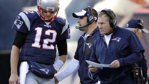 New England Patriots quarterback Tom Brady stands by head coach Bill Belichick during the first half of a Dec. 4, 2016, game against the Los Angeles Rams in Foxborough, Mass. (AP Photo/Elise Amendola)