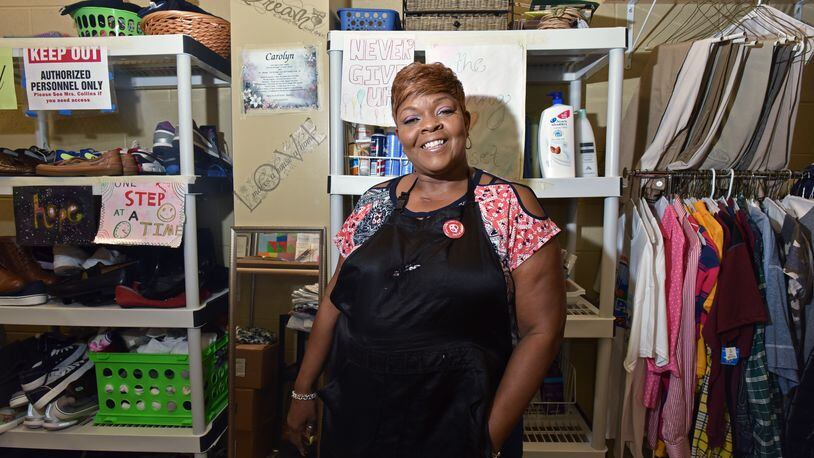 Custodian Carolyn Collins in the school-based closet where she started a nonprofit to give away clothes and other items to needy students at Tucker High School. Collins died from cancer in late December . HYOSUB SHIN / HSHIN@AJC.COM