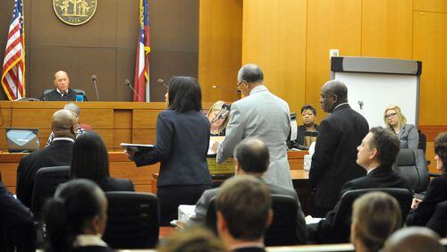 APRIL 14, 2015 ATLANTA Former APS Usher Collier Heights Elem testing coordinator Donald Bullock (right) stands as his defense attorney Hurl Taylor accepts a sentencing deal for 5 years probation, 6 months of weekends in jail, $5000 fine and 1500 hours of community service. Sentencing continues for 10 of the 11 defendants convicted of racketeering and other charges in the Atlanta Public Schools test-cheating trial before Judge Jerry Baxter in Fulton County Superior Court, Tuesday, April 14, 2015. (Atlanta Journal-Constitution, Kent D. Johnson, Pool)