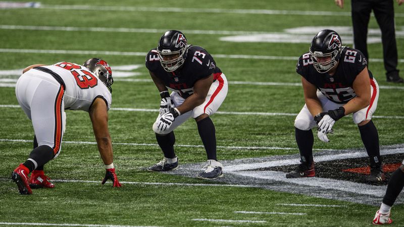 Falcons offensive tackle Matt Gono (73) and offensive guard Chris Lindstrom (63) line up against Tampa Bay Buccaneers defensive end Ndamukong Suh (93) during the first half Sunday, Dec. 20, 2020, at Mercedes-Benz Stadium in Atlanta. The Buccaneers won 31-27. (Danny Karnik/AP)