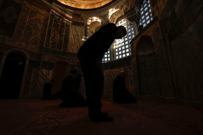 Muslim worshippers perform evening prayer in a former Byzantine church which formally opened as a mosque, in Istanbul, Turkey, Monday, May 6, 2024. Turkish President Recep Tayyip Erdogan formally opened a former Byzantine church in Istanbul as a mosque on Monday, four years after his government had designated it a Muslim house of prayer, despite criticism from neighboring Greece. (AP Photo/Emrah Gurel)