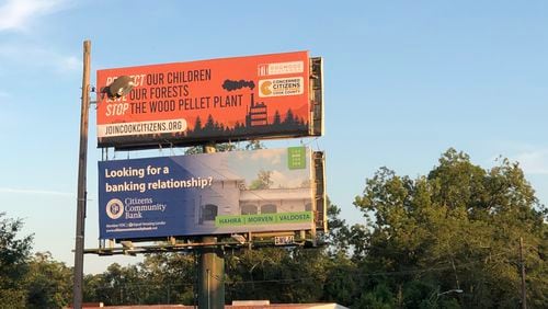 A billboard helps bring awareness to wood pellet plants slated for the city of Adel. Residents have filed a petition to appeal an air quality permit that would allow the world's largest wood pellet facility to open next to a predominantly Black and Hispanic neighborhood. COURTESY OF TREVA GEAR/CONCERNED CITIZENS OF COOK COUNTY