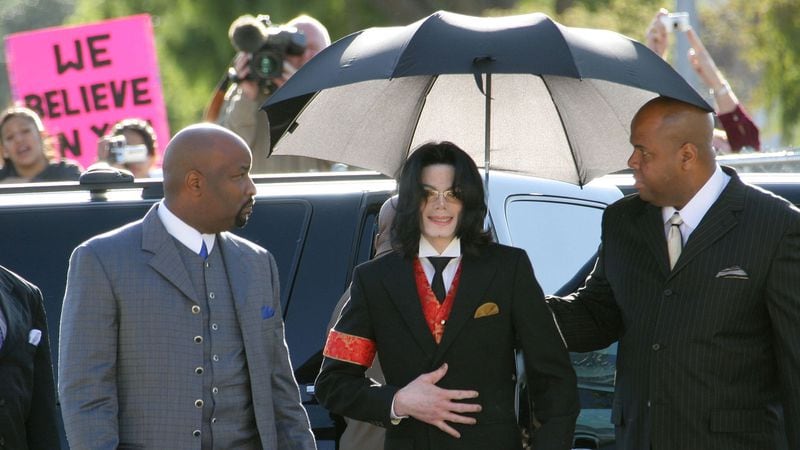 Michael Jackson arrives to the Santa Barbara County courthouse for his molestation trial April 14, 2004. Jackson was charged in a 10-count indictment with molesting a boy, plying him with liquor and conspiring to commit child abduction, false imprisonment and extortion.