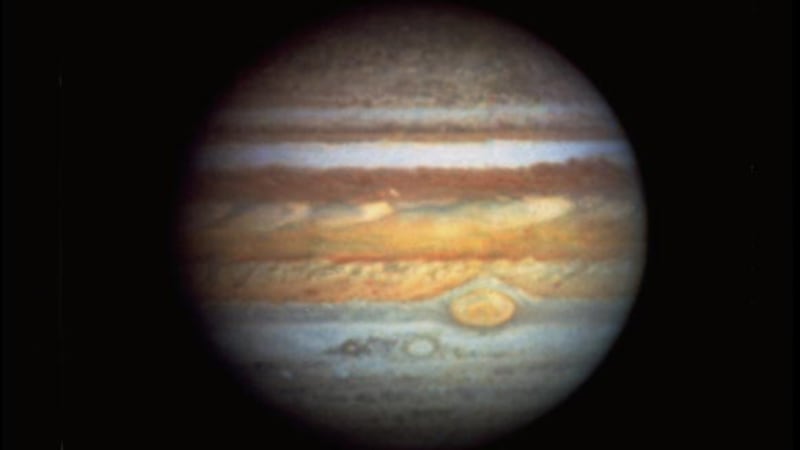 This is the first true-color photo of planet Jupiter taken by the Hubble Space Telescope.