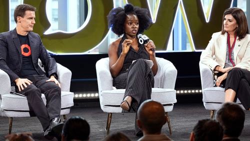 Hugh Evans, CEO of Global Citizen, left, listens as Actor Danai Gurira, center, addresses attendees of the Global Citizen Now conference, Wednesday, May 1, 2024, in New York. Fran Katsoudas is right. (AP Photo/Craig Ruttle)