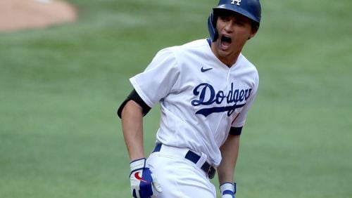Los Angeles Dodgers shortstop Corey Seager reacts to his solo home run against the Atlanta Braves during the first inning in Game 6 Saturday, Oct. 17, 2020, for the best-of-seven National League Championship Series at Globe Life Field in Arlington, Texas. (Curtis Compton / Curtis.Compton@ajc.com)