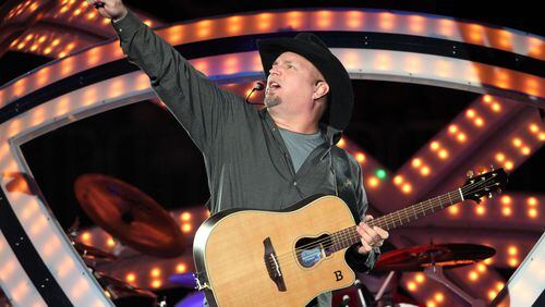 #3 of #27. PLEASE KEEP IN SEQUENTIAL ORDER FOR THE CONTINUITY OF THE GALLERY. -Garth Brooks sings "Man Against Machine." Legendary country singer-songwriter-guitarist Garth Brooks played the fist of seven sold out shows Friday evening at Philips Arena. Robb D. Cohen/RobbsPhotos.com Garth Brooks at Philips Arena Sept. 19. 2014. Photo: Robb Cohen/www.RobbsPhotos.com.