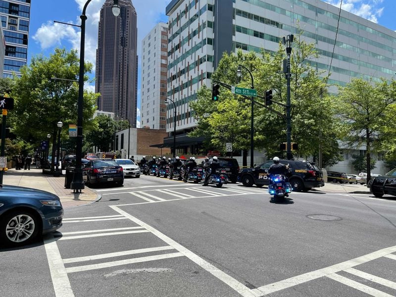 Several blocks of Peachtree Street are blocked Wednesday after an officer was shot at an apartment building. There is a heavy police presence in the area.