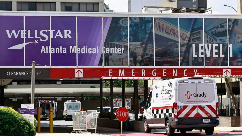 A Grady Hospital ambulance pulls into the emergency entrance of Wellstar Atlanta Medical Center on Monday, September 12, 2022. (Natrice Miller/natrice.miller@ajc.com). 