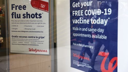 Flu and coronavirus (COVID-19) vaccine signage is seen at a Duane Reade by on Broadway on January 05, 2023 in New York City. (Michael M. Santiago/Getty Images/TNS)