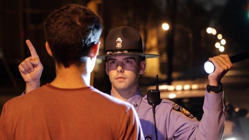 A Georgia State Patrol trooper performs a field sobriety test on a driver in 2011. The driver passed the test. Curtis Compton/AJC ccompton@ajc.com