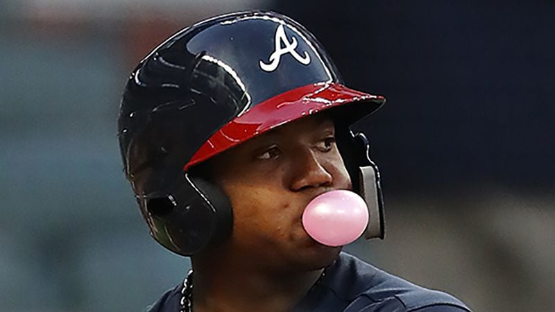 March 27, 2018 Atlanta: Braves outfielder Ronald Acuna Jr., blows a bubble while he bats during the first inning in the Future Stars Exhibition Game on Tuesday, March 27, 2018, at SunTrust Park in Atlanta.  Curtis Compton/ccompton@ajc.com