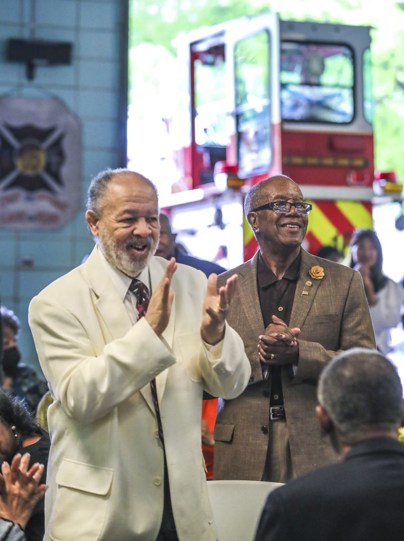March 31, 2023 Atlanta: Former AFRD Chief William Hamer (left) and former assistant chief Frank Bolden (right) stand to be recognized during Friday’s event.  The Atlanta Fire Rescue Department honored the first African American men and women firefighters hired by the City of Atlanta on the 60th anniversary of the AFRD’s integration on April 1, 1963, and in 1977, respectively. The event was held at fire station 16 located at 1048 Joseph E. Boone Boulevard NW in Atlanta. The first African American firefighters and their representatives in attendance were presented with a sentimental gift for their contributions. (John Spink / John.Spink@ajc.com)

