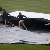 Groundcrew put the tarp on the infield before game three between Cartersville and Loganville in the Class 5A GHSA baseball finals at Coolray Field, Friday, May 17, 2024, in Lawrenceville, Ga. (Jason Getz / AJC)
