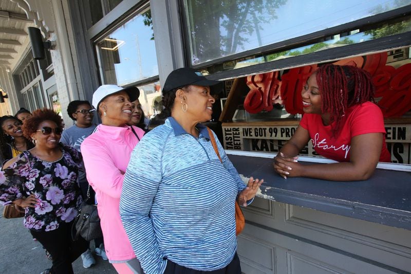Customers wait in line at Slutty Vegan, owned by Pinky Cole. The vegan restaurant sells 1,600 burgers daily. TYSON A. HORNE / TYSON.HORNE@AJC.COM