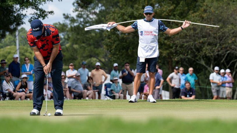 Patrick Reed lines up a putt on the first hole during the first round of the Tour Championship on Thursday, Sept. 2, 2021, at East Lake Golf Club in Atlanta. (Ben Gray/For the AJC)