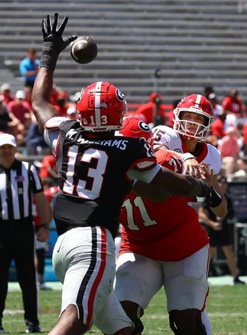 Defensive lineman Mykel Williams deflects a pass by quarterback Carson Beck during the G-Day game on Saturday, April 13, 2024.  Curtis Compton for the Atlanta Journal Constitution