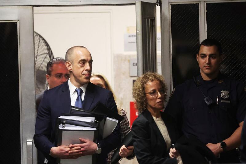 Former President Donald Trump's attorneys Emil Bove and Susan Necheles enter Manhattan criminal court in New York, Friday, April 19, 2024. (Spencer Platt/Pool Photo via AP)