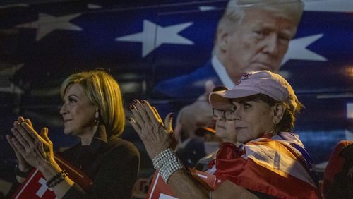 Republican supporters clap as they hear the voice of President Donald Trump during a Republican rally in the parking lot at the Georgia Republican Party headquarters in Atlanta’s Buckhead community, Thursday, November 5, 2020. (Alyssa Pointer / Alyssa.Pointer@ajc.com)