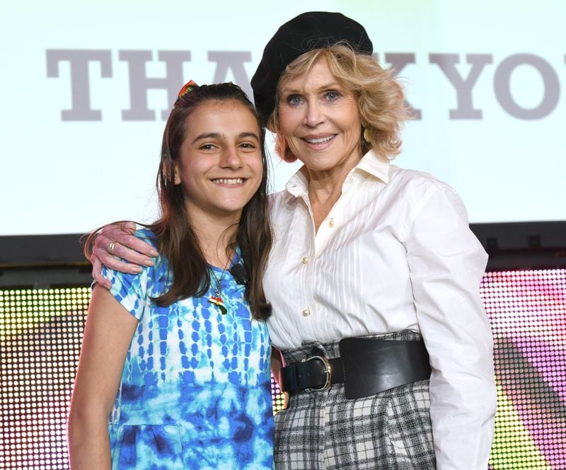 Jane Fonda is shown with Nawroz Youssef, a Syrian refugee who attends the Paideia School and hopes to one day become a doctor, at the Oct. 5 GCAPP event. RICK DIAMOND / GETTY IMAGES
