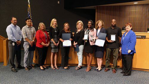 Gwinnett’s budget and communications staff along with Commission Chaariman Charlotte Nash receive awards for the Bicentennial Celebration website and four other at the National Association of County Information Officers awards competition in Nashville on July 15. Courtesy Gwinnett County