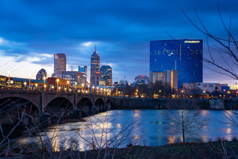 A view from White River State Park takes in the skyline of downtown Indianapolis and the pedestrian bridge spanning the river. Photos: Visit Indy